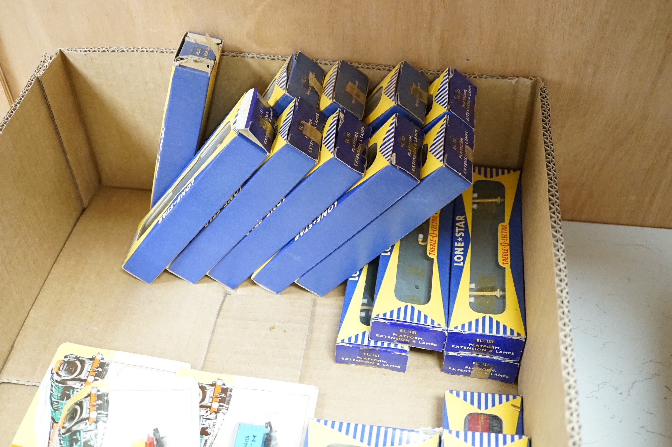 Sixty-two boxed items of Lone Star 000 gauge model railway including; a tunnel, Brake End Coaches, bogie wagons, station platforms, platform extensions, signal boxes, box vans, and telegraph poles